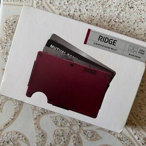 RIDGE Slim RFID blocking wallet in Black Cherry cash strap